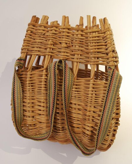 Baskets in the Hebrides, like those in Orkney and Shetland, were carried on the back. Hebridean creels were more durable, made from willow. This beautifully-made child's one has arm straps, while adults' ones had a single strap worn over the upper chest.