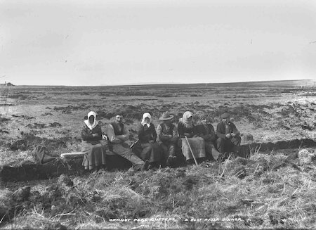 Work involved families and neighbours spending long days on the moors, turning and heaping the peats. Whenever people stopped, like this Orkney group, they were at the mercy of the hated midges.
