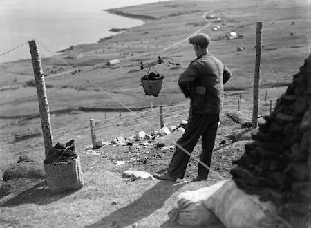 Changes came to how folk got their peats home in the 20th century. In Shetland’s steeper districts like Weisdale, pulleys were used to convey loads downhill, like a cablecar.